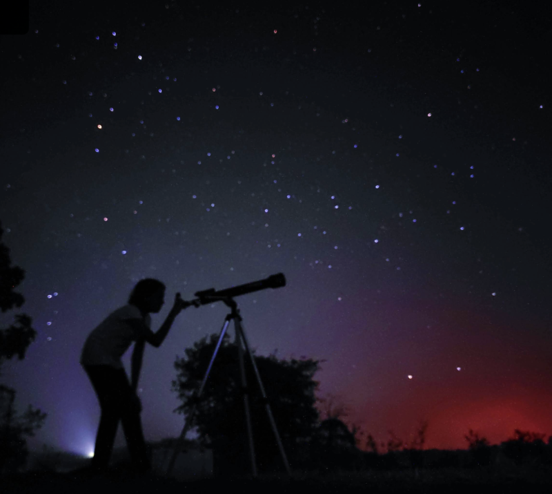 My daughter looking at a planet